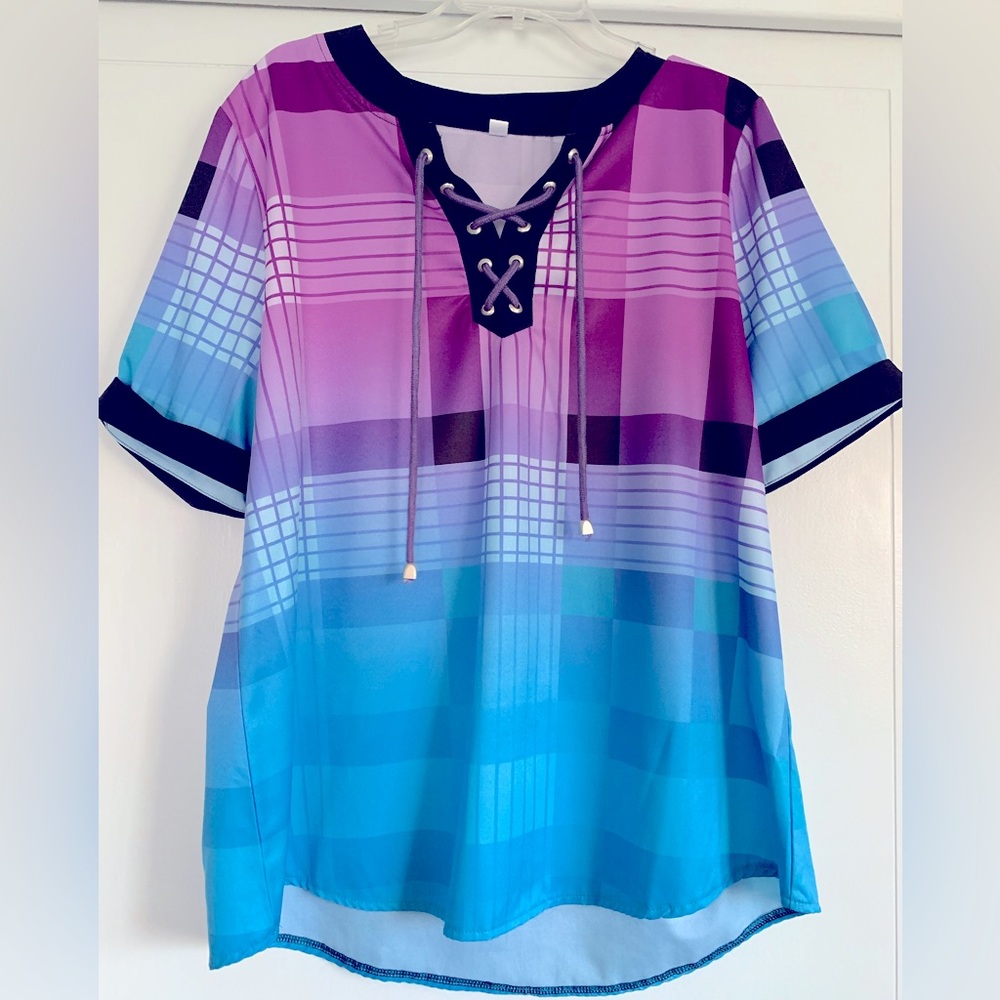 Soft, colorful lightweight blouse with laced color.  Size runs smaller.  XL = L